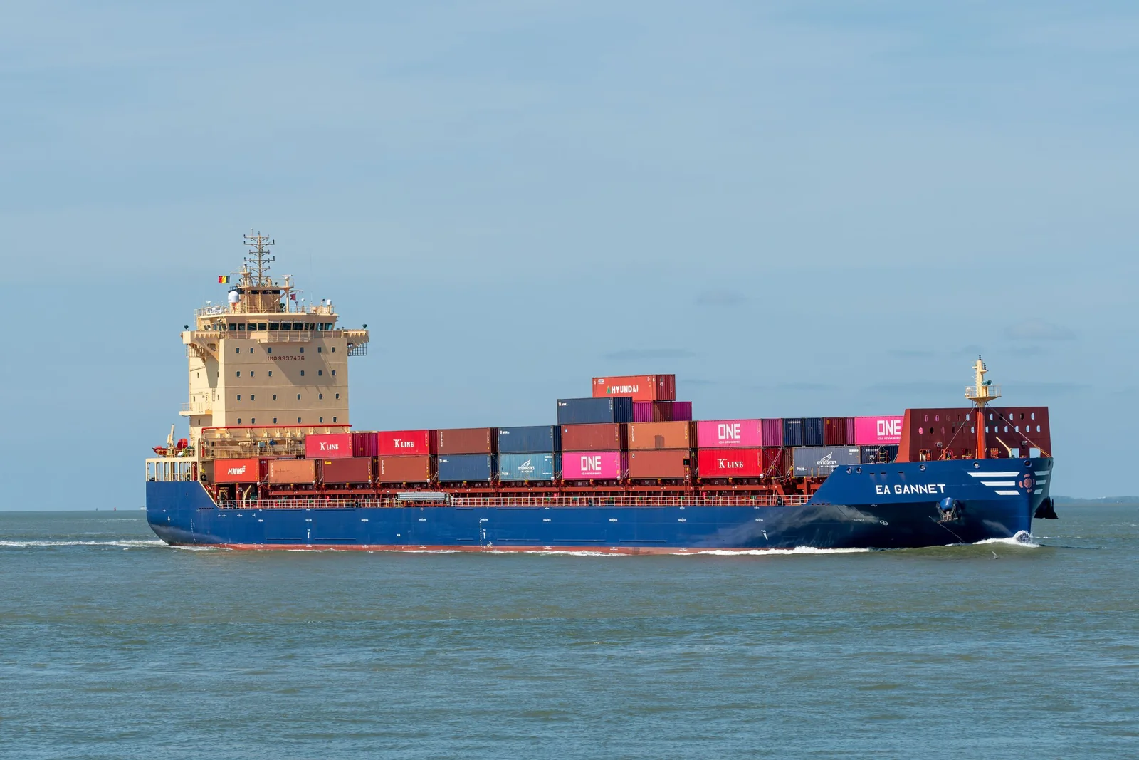 Container ship loaded with shipping containers at sea