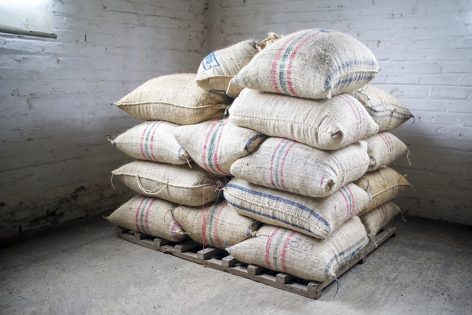 Sacks of dried agricultural product stacked for trade